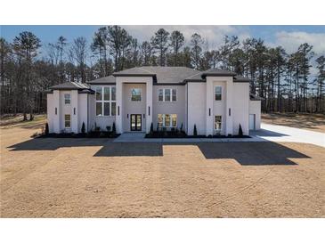 Stunning two-story home with modern design and landscaping at 1682 Union Grove Church Rd, Auburn, GA 30011