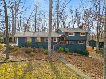 Newly painted two-story home with wood accents and a landscaped yard at 3741 Hickory Se Cir, Smyrna, GA 30080