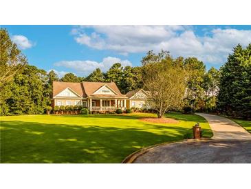 Stunning two-story home with expansive lawn and inviting front porch at 260 Koller Dr, Powder Springs, GA 30127