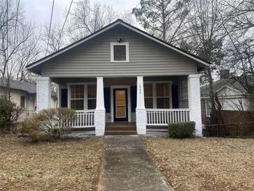 Charming craftsman home with front porch and landscaped yard at 1790 Spring Ave, East Point, GA 30344