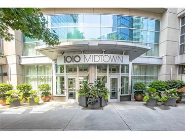 1010 Midtown building entrance with landscaping at 1080 Peachtree St # 2406, Atlanta, GA 30309