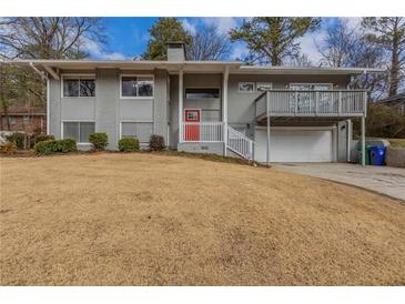Inviting two-story home features a well-manicured lawn and neutral paint scheme at 2919 Alameda Trl, Decatur, GA 30034