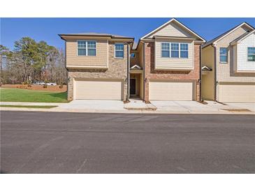 New townhome community with attached garages, and beautifully landscaped lawns at 4131 Fulson Dr, Lilburn, GA 30047