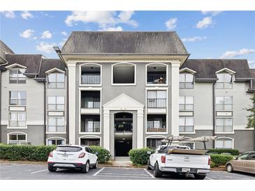 Three-story apartment building with gray facade and balconies at 2657 Lenox Ne Rd # 134-2, Atlanta, GA 30324