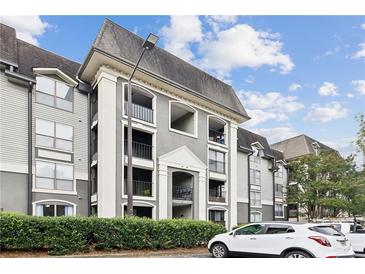 Attractive condo building with private balconies and well-maintained landscaping at 2657 Lenox Ne Rd # 134-2, Atlanta, GA 30324