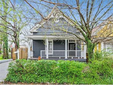 Charming gray house with white porch and well-manicured hedges at 601 Formwalt Sw St, Atlanta, GA 30312