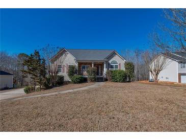 Charming single-Gathering home with landscaped front yard and walkway leading to the entrance at 287 Jenna Ln, Dallas, GA 30157