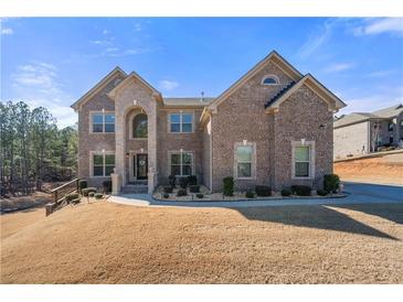 Brick two-story house with landscaping and a paved driveway at 6117 Summerstone Ln, Douglasville, GA 30135