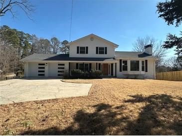 Stunning ranch home features a newly renovated exterior, fresh landscaping and a large backyard at 1902 E Piedmont Rd, Marietta, GA 30062