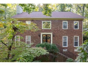 Brick two-story house with double doors and landscaping at 2339 Milstead Cir, Marietta, GA 30066