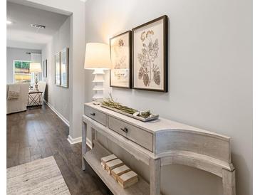 Bright entryway with wood floors and console table at 5591 Hislop Lane # 77, Mableton, GA 30126