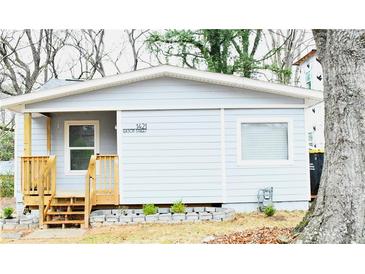 Charming single-story home with a quaint front porch and a well-maintained yard, creating an inviting curb appeal at 1421 Eason St, Atlanta, GA 30314