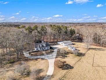 Aerial view of a house with detached garage and expansive lot at 295 W 5 Hwy, Roopville, GA 30170