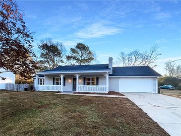 Newly renovated ranch home with carport and spacious backyard at 4620 Cedar Brook Se Dr, Conyers, GA 30094