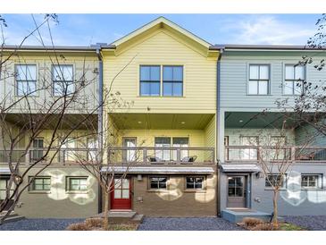Colorful townhouses with individual entrances and balconies in a modern design community at 720 Perch Pl, Atlanta, GA 30312