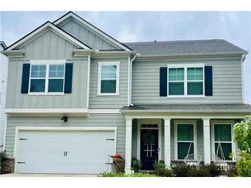 Two-story house with gray siding, black shutters, and a white front door at 339 Garnet Dr, Acworth, GA 30101