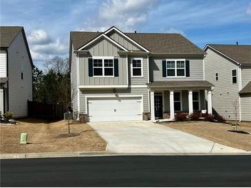 Charming two-story home with a well-manicured lawn and attached two-car garage at 339 Garnet Dr, Acworth, GA 30101