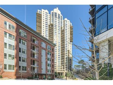 Luxury high-rise building with city views and nearby townhouses at 3481 Lakeside Ne Dr # 701, Atlanta, GA 30326