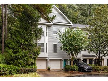 Charming townhome featuring a well maintained front yard and attached garage at 951 Glenwood Se Ave # 3001, Atlanta, GA 30316