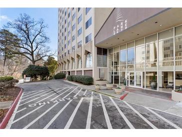 A high-rise building with well-maintained landscaping and a designated parking area at 2479 Peachtree Ne Rd # 605, Atlanta, GA 30305