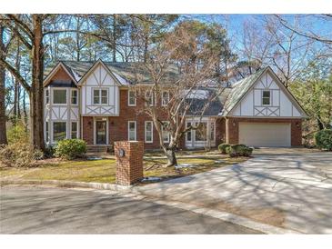 Brick two-story house with a large yard and attached garage at 3964 Preston Ne Ct, Brookhaven, GA 30319