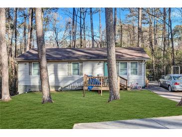 Charming ranch home with a deck and spacious yard at 4646 Biffle Rd, Stone Mountain, GA 30088