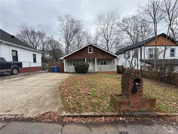 Charming exterior of a home with a well-maintained front yard and a cozy porch at 980 Linam Se Ave, Atlanta, GA 30315