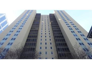 Tall building with windowed exterior at 300 W Peachtree St # 21N, Atlanta, GA 30308