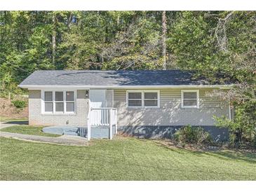 Charming single-story home with a well-maintained front yard and inviting entrance at 3459 Adkins Nw Rd, Atlanta, GA 30331