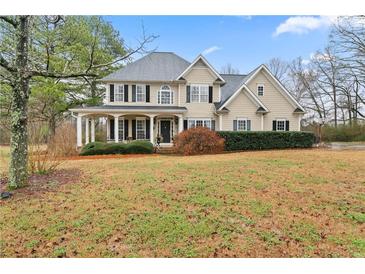 Charming two-story traditional home with a large front porch, manicured landscaping and a well kept lawn at 21 Cass Station Pass Nw Pass, Cartersville, GA 30121