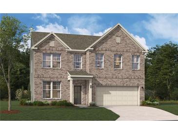 Two-story brick home featuring a two-car garage and a well-manicured lawn at 140 Kingsley Way, Acworth, GA 30102