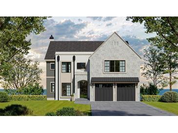 A stunning two-story home with a stone facade, dark grey garage doors, manicured lawn, and professional landscaping at 140 Lake Estates Dr, Roswell, GA 30075