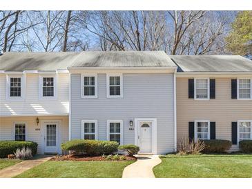 Charming townhouse with manicured lawn and inviting front walkway at 834 Heritage Sq, Decatur, GA 30033