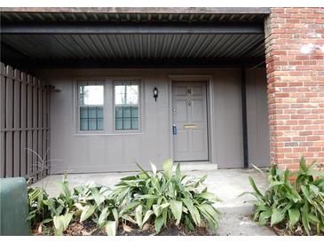 Exterior front door with an architectural design and window views at 3083 Colonial Way # N, Atlanta, GA 30341