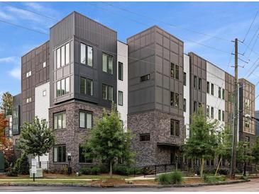 Modern condominium complex featuring a mix of brick, metal, and siding accents at 383 Grant Se Cir # 1634, Atlanta, GA 30315