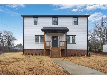 Charming two-story home featuring a brick foundation and a welcoming, covered front porch at 190 Adair Se Ave, Atlanta, GA 30315