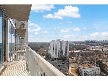 Enjoy city views from this condo's private balcony with floor-to-ceiling glass windows at 3324 Peachtree Ne Rd # 1510, Atlanta, GA 30326