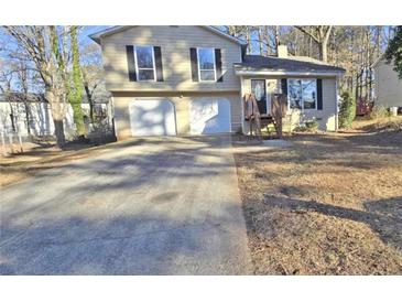 Charming home with two-car garage and a long driveway, set amidst a serene landscape at 508 Jaywood Dr, Stone Mountain, GA 30083