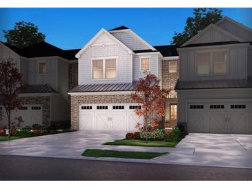 Charming new construction townhome with a two-car garage and professionally landscaped yard at 4629 Electric Ave, Mableton, GA 30126
