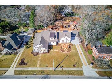 Expansive aerial view of a home featuring a manicured lawn and inviting stone walkway at 505 Cochran Dr, Norcross, GA 30071