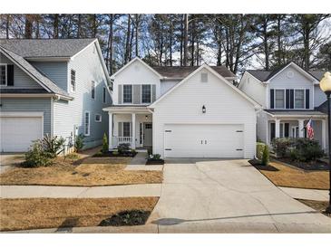 Charming two-story home with a well-manicured lawn and a two-car garage at 780 Gardenside Se Cir, Marietta, GA 30067