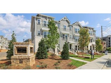 Attractive townhome complex with manicured landscaping in a desirable community at 125 Silvia Ln # 24, Hapeville, GA 30354