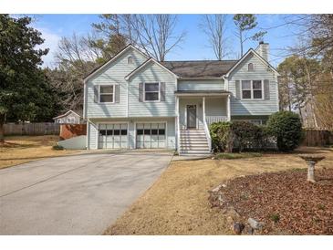 Charming two-story home with a two-car garage, well-maintained lawn, and a cozy front porch at 88 Linville Pte, Dallas, GA 30157