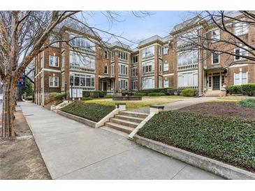 Beautiful brick apartment building with landscaped entrance and sidewalks at 272 14Th Ne St # 18, Atlanta, GA 30309