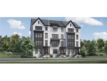 Beautiful three-story townhome with brick and stucco facade, black trim and a modern design at 3462 Dryden Se Ln, Vinings, GA 30339
