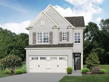 Charming two-story home with white brick, a two-car garage, and lush landscaping at 4220 Cavalier Way, Duluth, GA 30097