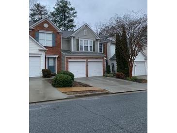 A charming townhouse with a two-car garage is a perfect place to call home at 2394 Elkhorn Ter, Duluth, GA 30096
