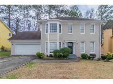 Charming two-story home with neutral color and a two-car garage at 3174 Palm Tree Dr, Lithonia, GA 30038