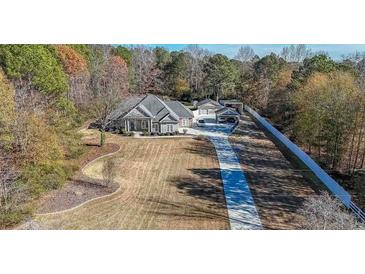 Beautifully landscaped property featuring a long driveway and well-maintained grounds at 3410 Church Rd, Villa Rica, GA 30180