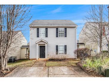 Charming two-story home featuring a welcoming entrance and well-maintained landscaping in a cozy neighborhood at 256 Coral Cir, Mcdonough, GA 30253